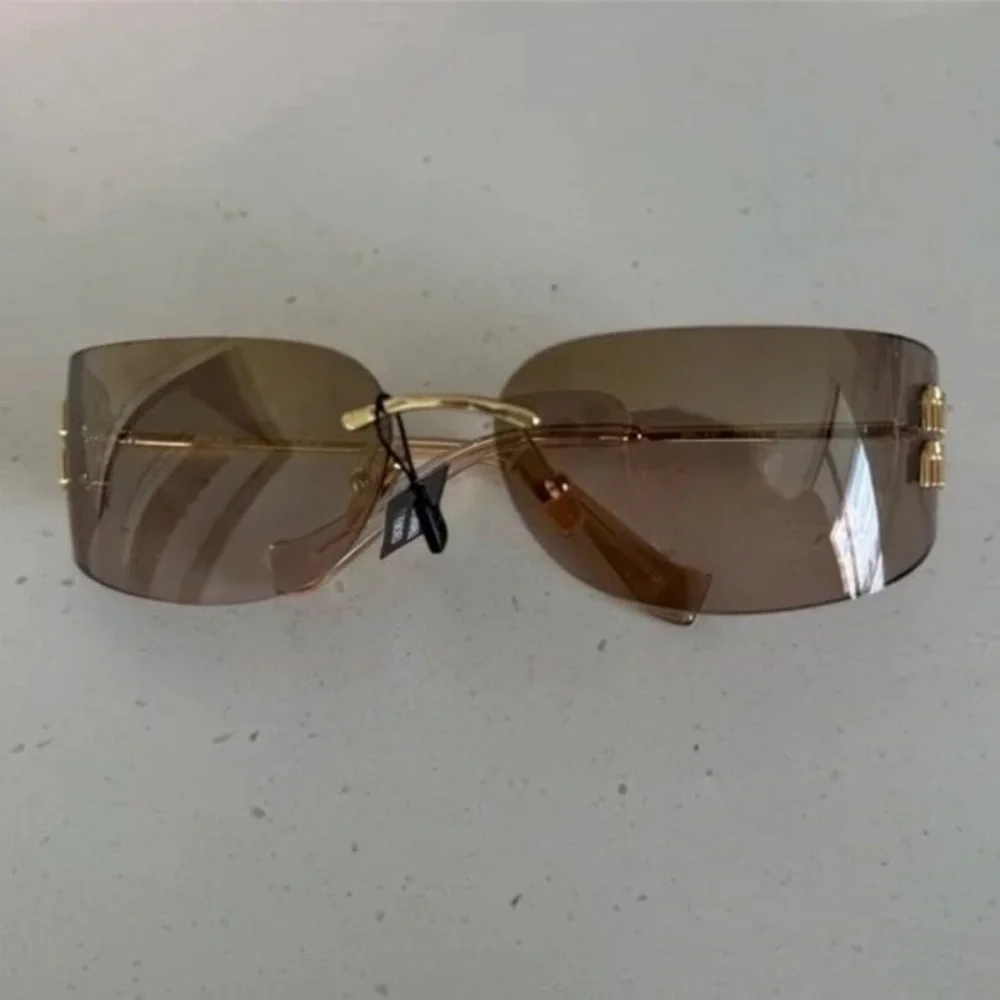 Miu Miu Rimless Pink Gradient Sunglasses with Gold Hardware